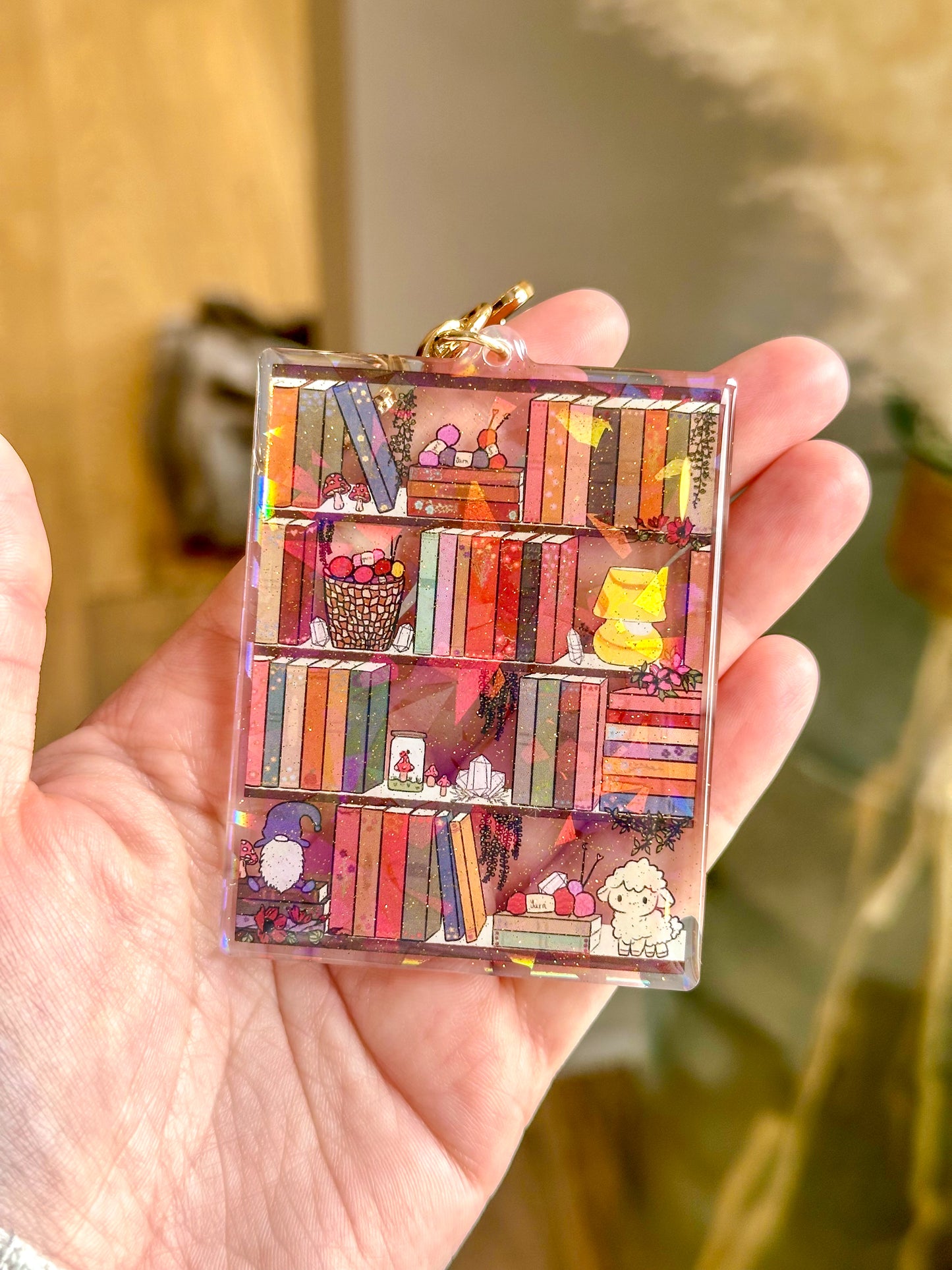 The Cozy Cottage Bookshelf Acrylic Holographic Keychain