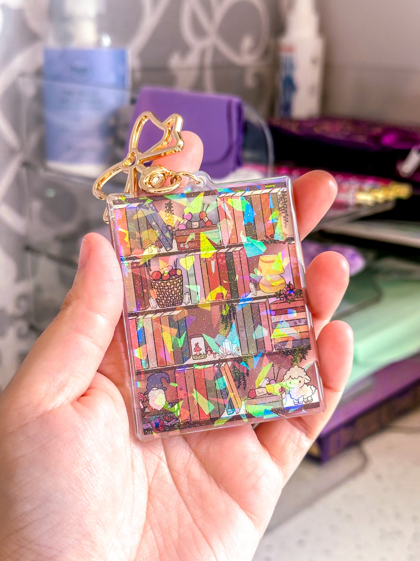 The Cozy Cottage Bookshelf Acrylic Holographic Keychain