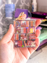 Load image into Gallery viewer, The Cozy Cottage Bookshelf Acrylic Holographic Keychain
